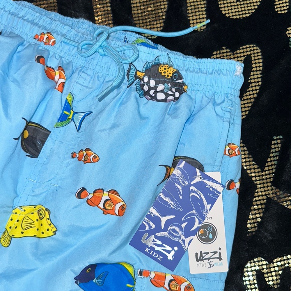UZZI KIDZ large activewear swim trunk NWT Light blue